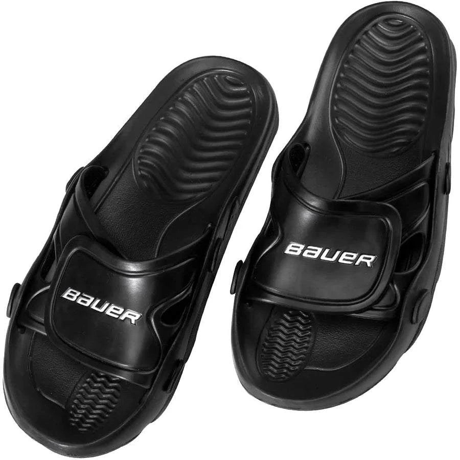 Black Bauer sandals with a white background