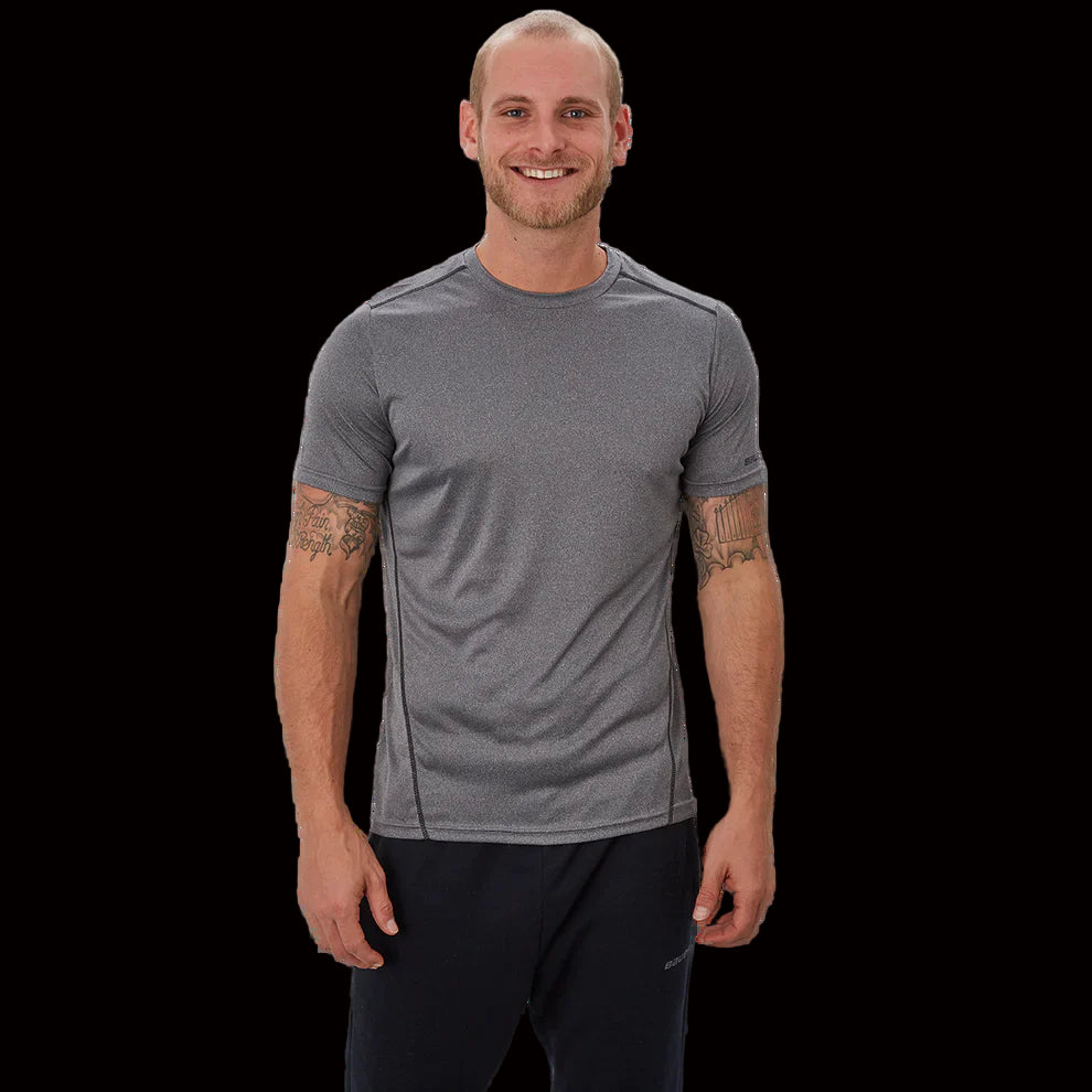 Bauer Vapor team Tech Tee in black, moisture-wicking polyester, tapered fit.