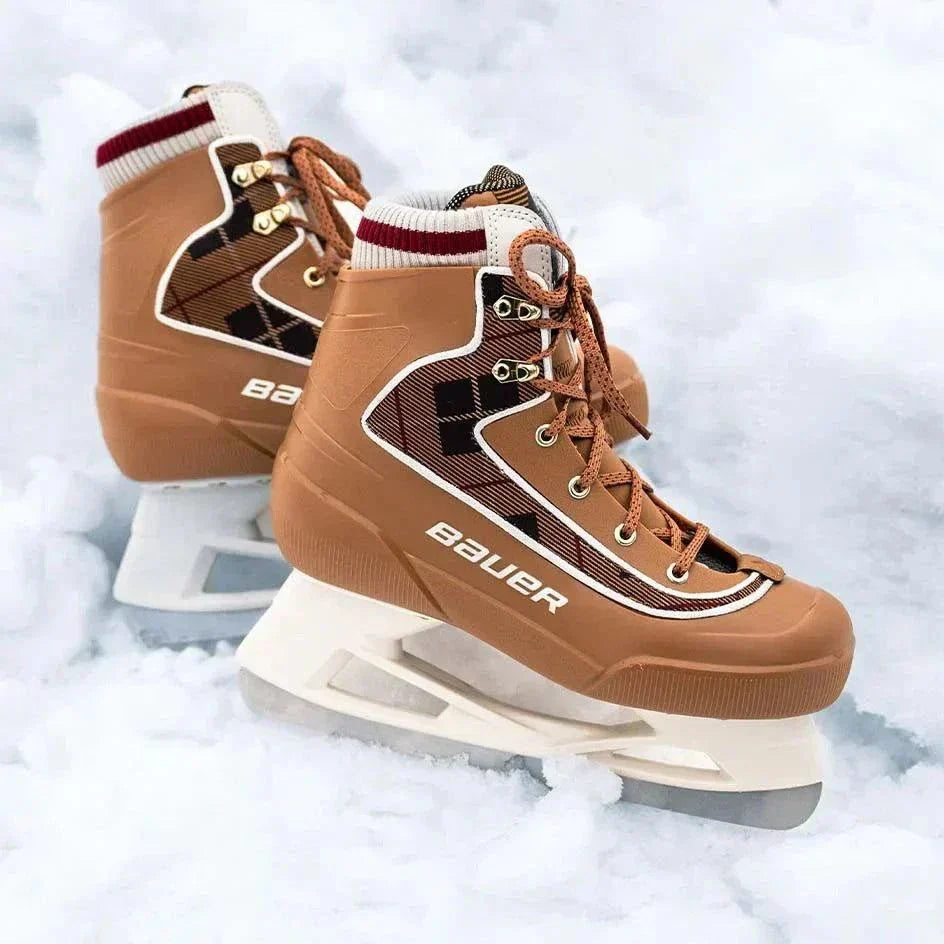 Bauer Chamonix Lifestyle Skates with plaid design and sherpa lining on snow.