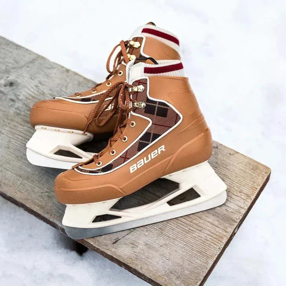 Bauer Chamonix Lifestyle Skates on wooden bench, showcasing synthetic leather, sherpa lining, and stylish plaid design.
