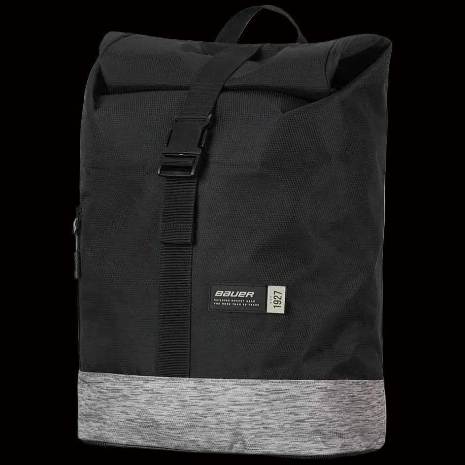 A black Bauer Collage Backpack with a rolltop design, featuring a front pocket and a zippered closure.