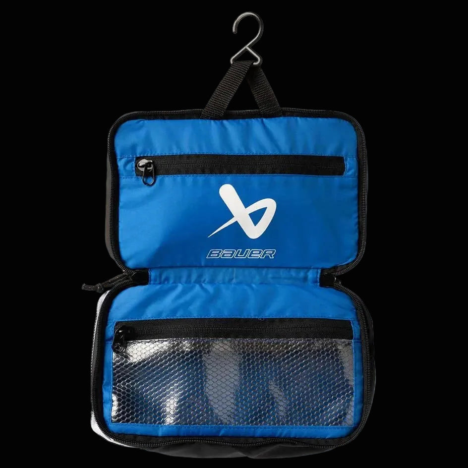 Blue toiletry bag with black zippers and a visible bauer logo on a white background