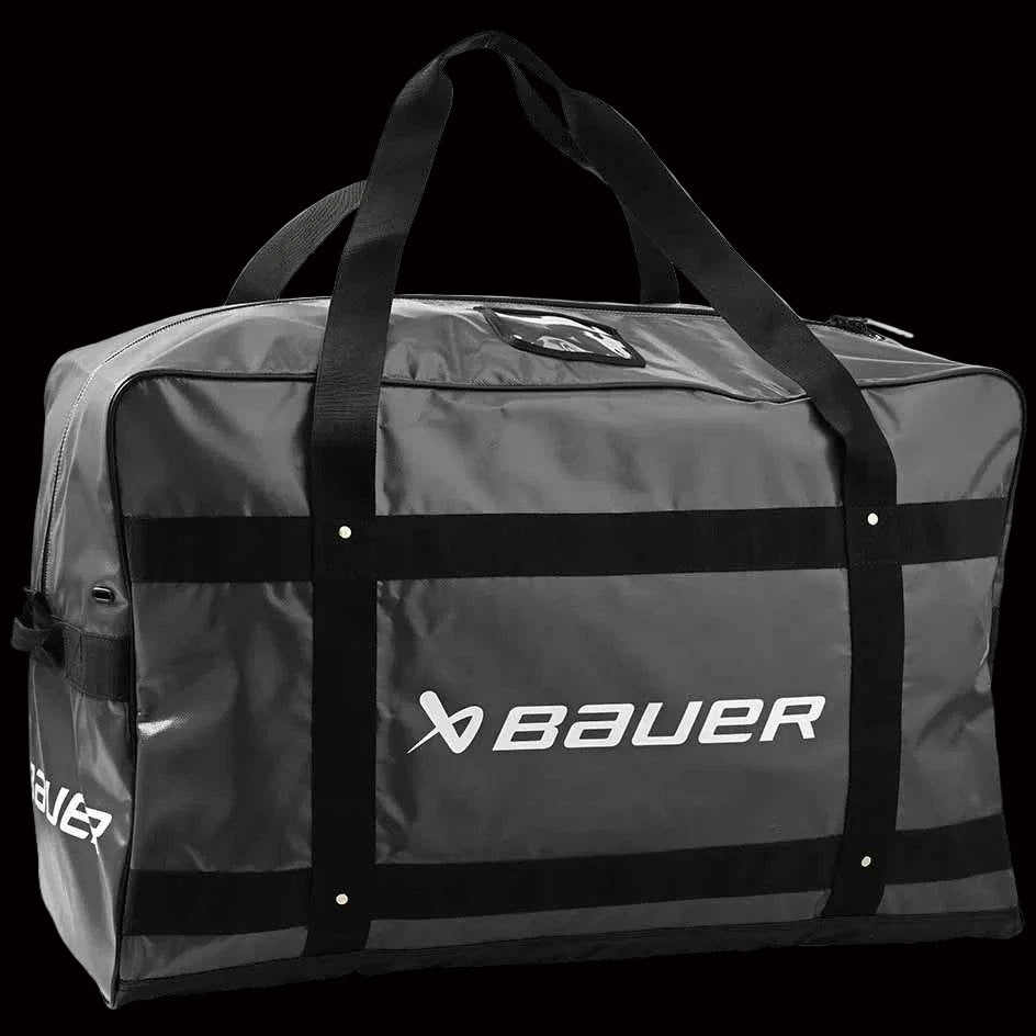 Bauer Pro Carry Bag with durable Pro-Tarp materials and YKK zippers, featuring dry-flow grommets for ventilation and internal mesh pockets.