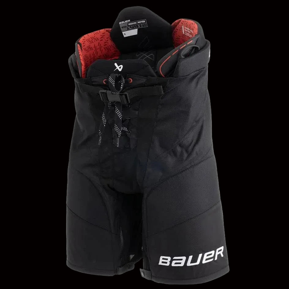 A pair of black Bauer Pro women's hockey pants with red and white interior lining.