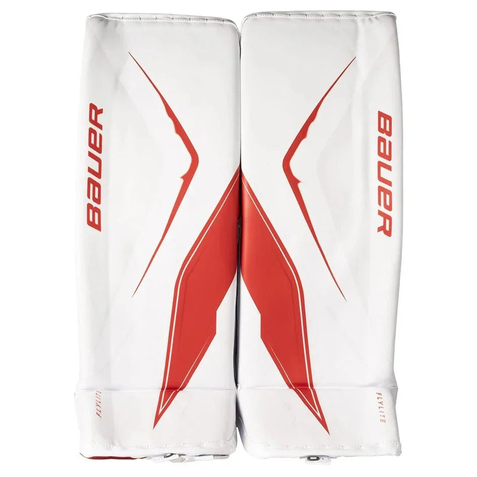 White hockey leg pads with red accents and Bauer branding on a white background