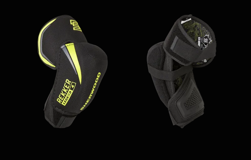 A pair of Sherwood Elbow Pad Rekker Legend 4 in black with green accents, featuring straps and 3D molded protection.
