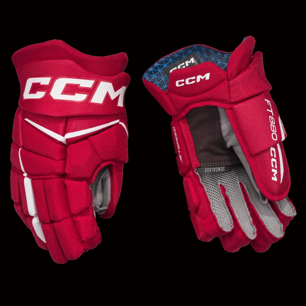 CCM JetSpeed FT880 hockey gloves in red and white showing cuff and wrist protection