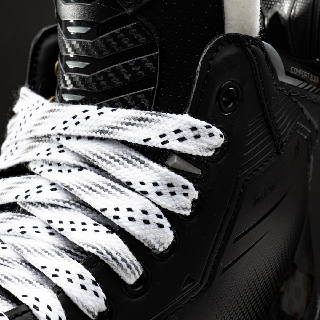 Bauer Supreme Shadow Ice Hockey Skate close-up showing lace detail and sleek black design.