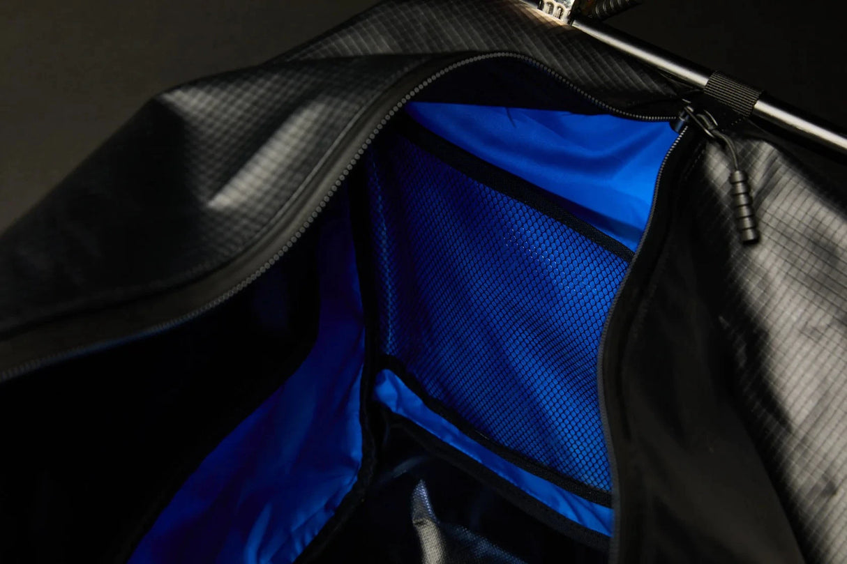 Interior of Bauer Tactical Carry Bag showing blue liner and mesh pockets.