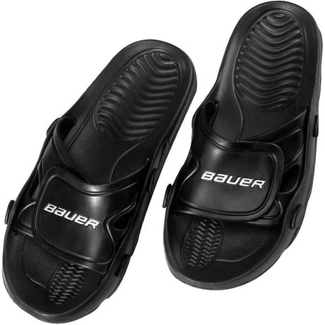 Black Bauer sandals with a white background