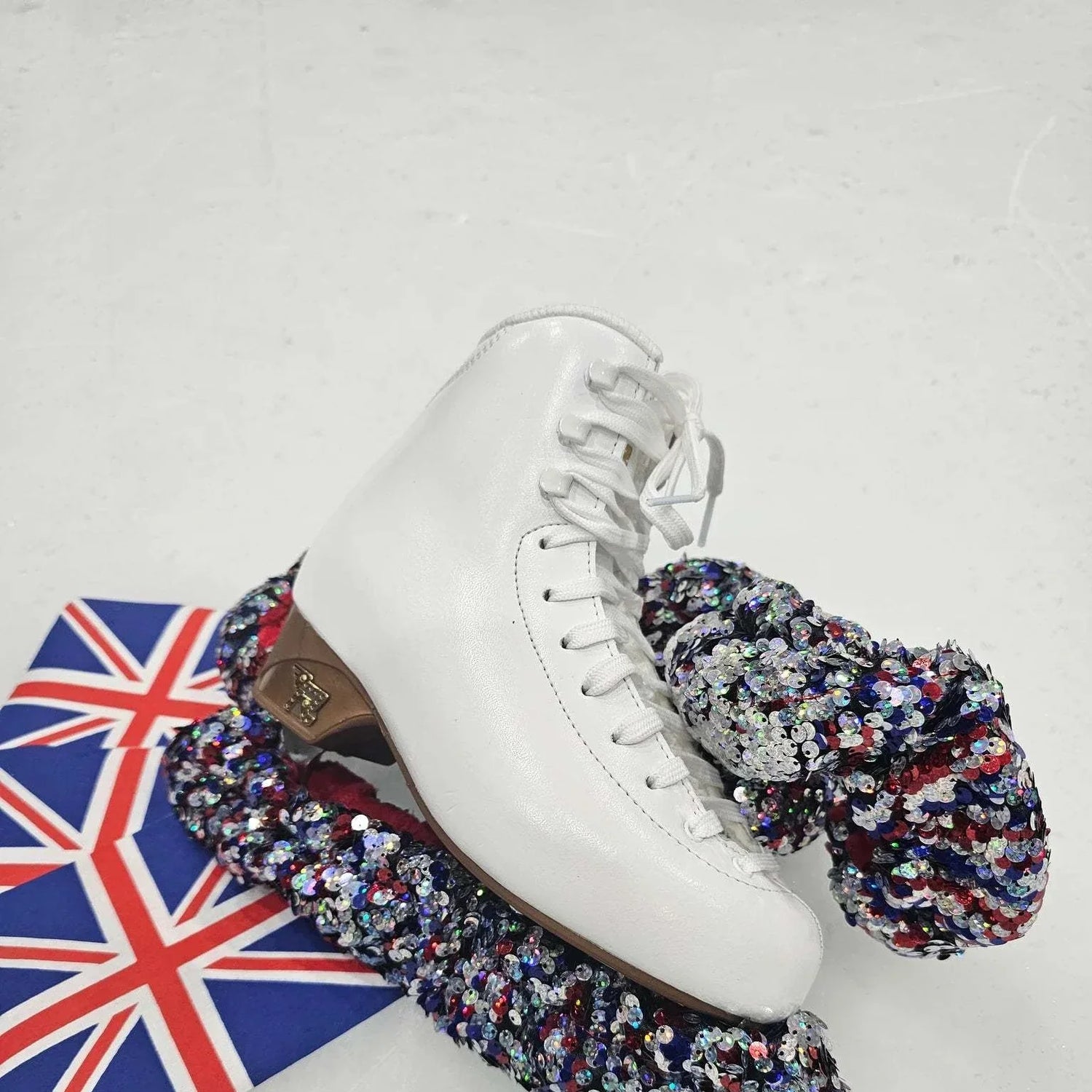 Guardog Soft Paws Sequins Blade Soakers on ice skate with UK flag background