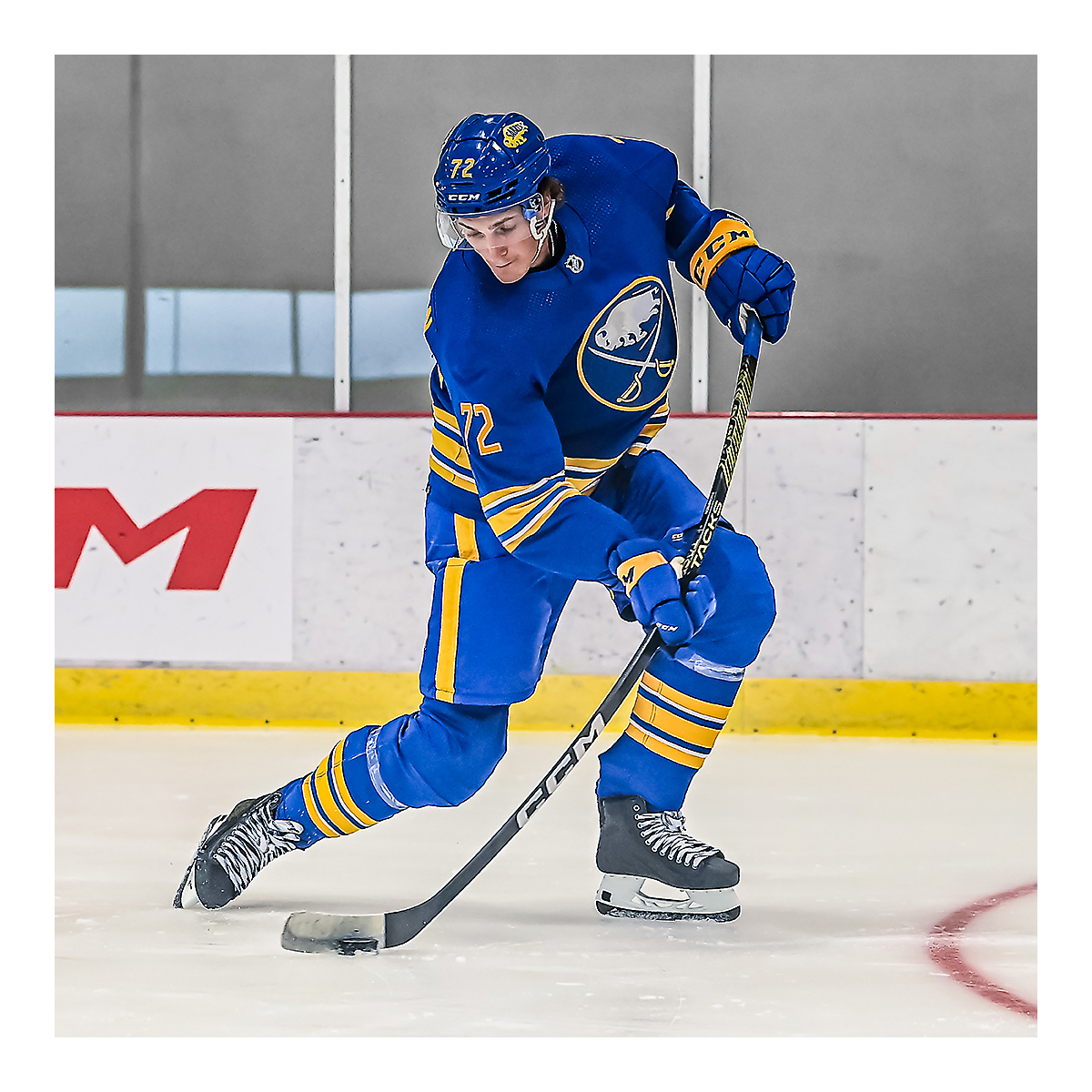 Hockey player using CCM Tacks AS6 Pro Hockey Stick on ice.