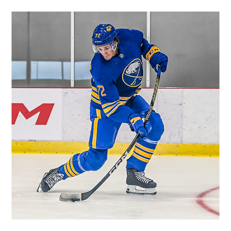 Hockey player using CCM Tacks AS6 Pro Hockey Stick on ice.