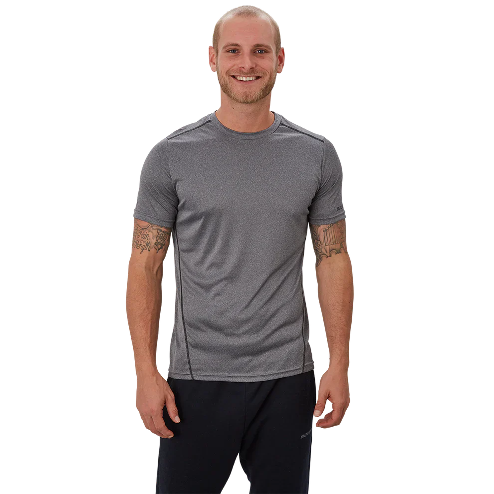 Bauer Vapor team Tech Tee in black, moisture-wicking polyester, tapered fit.