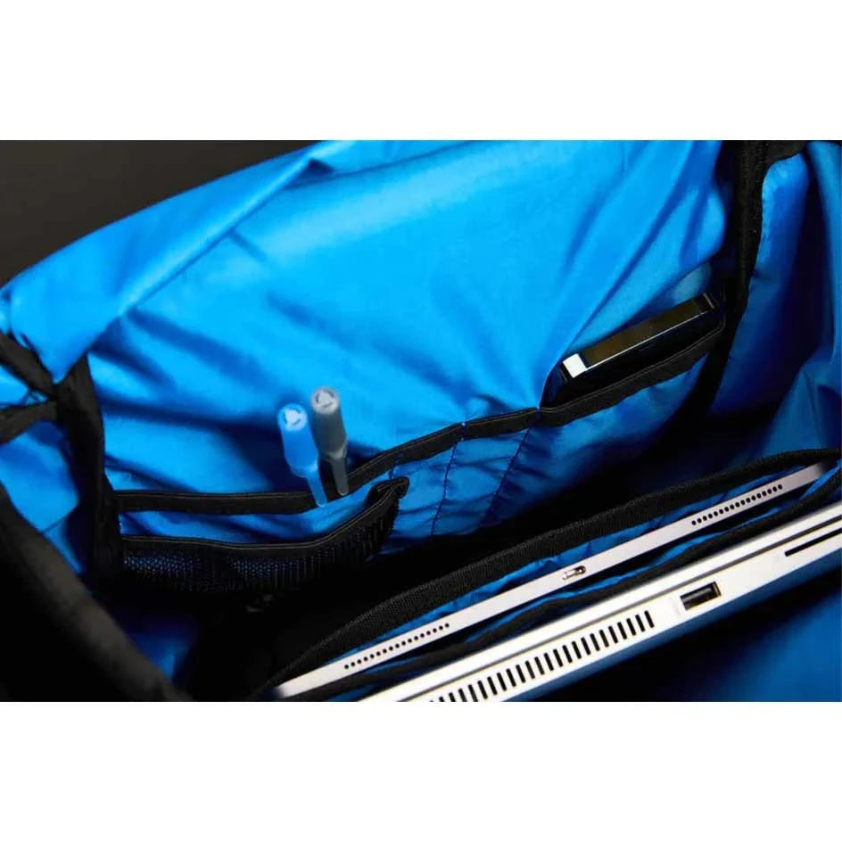 Interior view of Bauer Tactical Backpack showing blue liner, laptop and tablet sleeves, and accessory pockets.