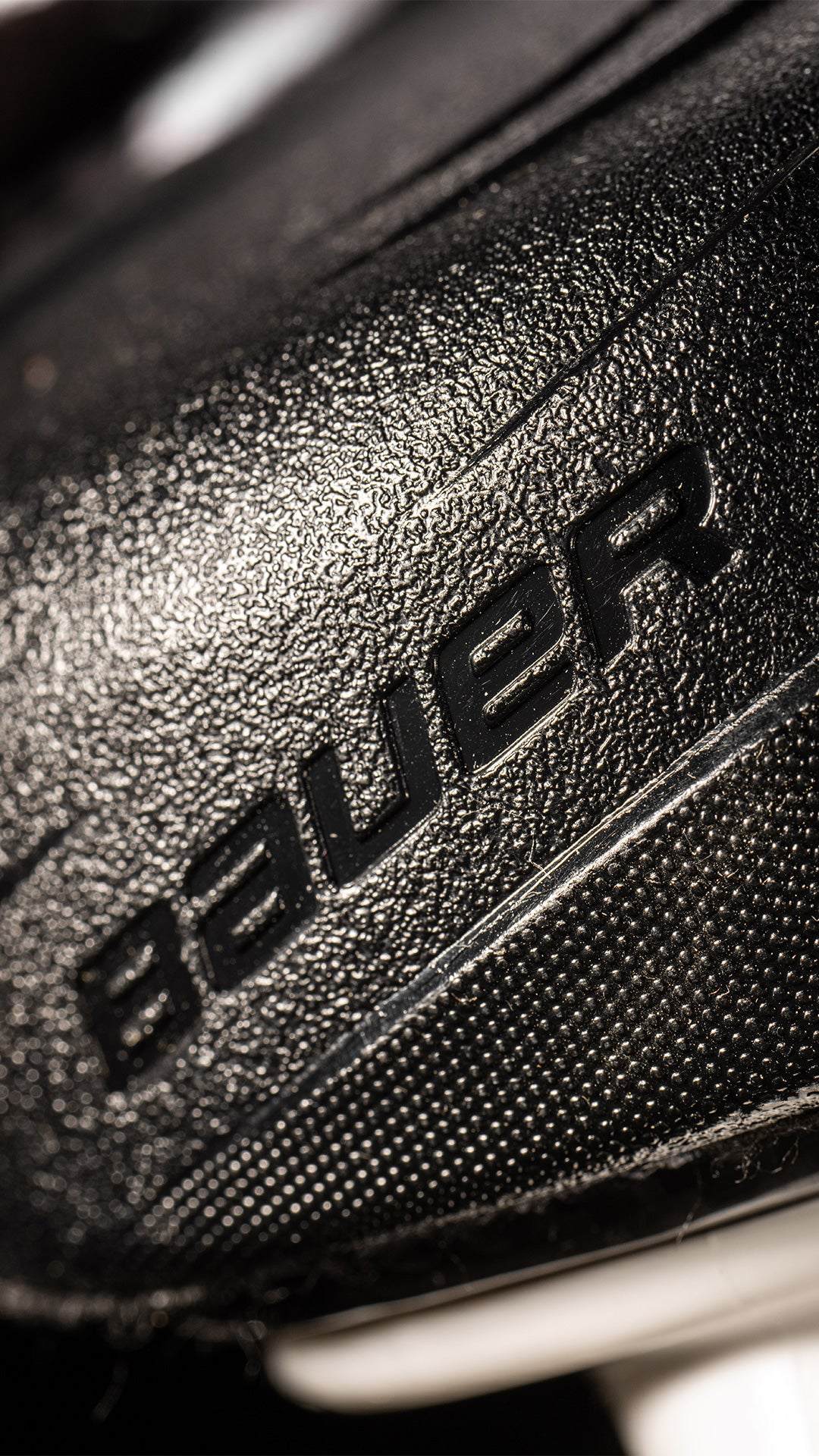 Bauer Vapor Hyperlite2 Skates close-up, showing durable texture and branding.