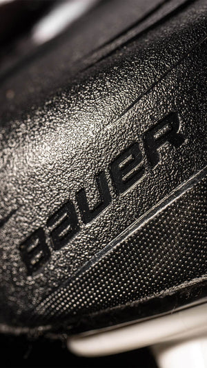 Bauer Vapor Hyperlite2 Skates close-up, showing durable texture and branding.
