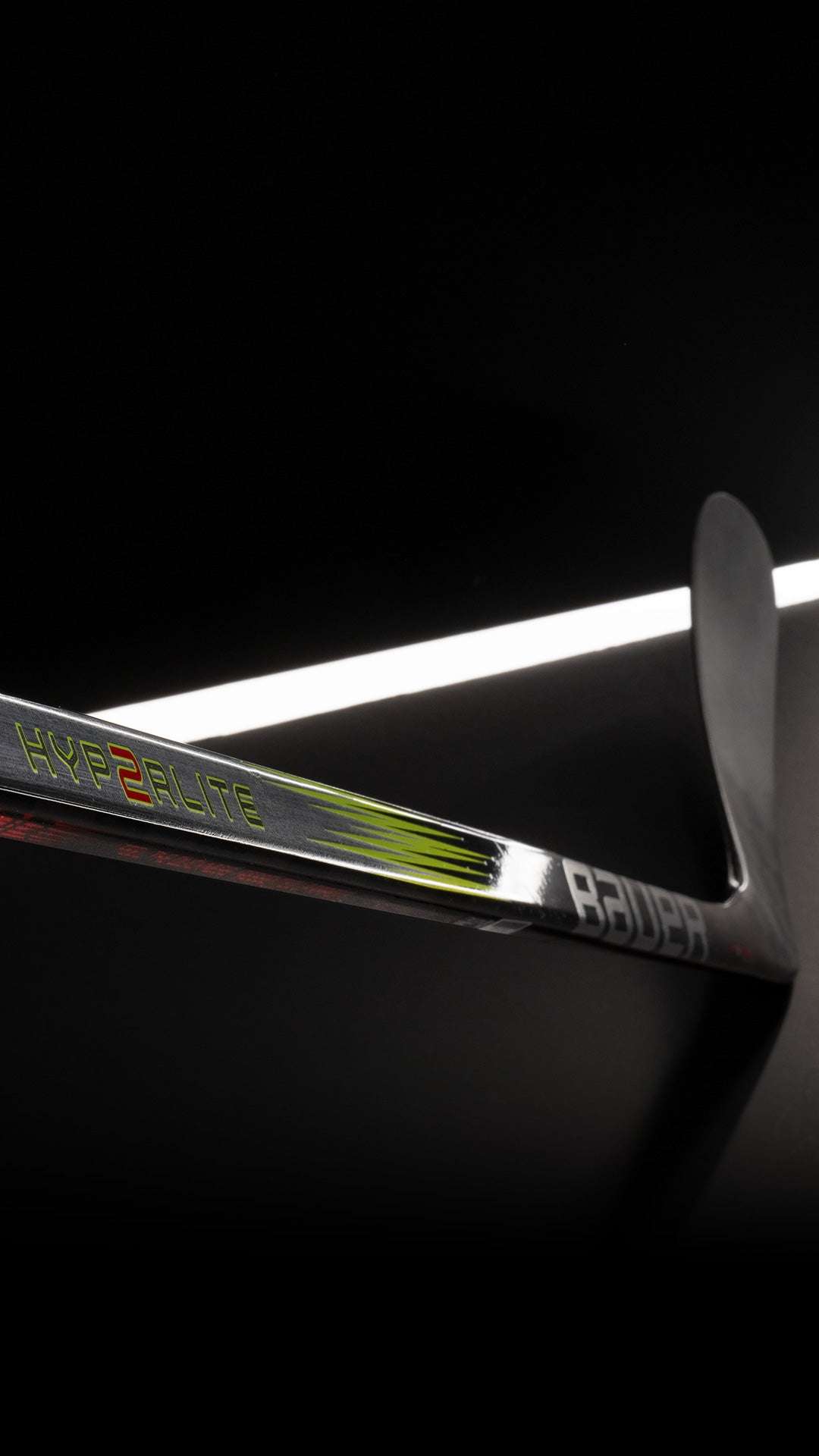 Bauer Vapor Hyperlite 2 Hockey Stick with advanced carbon technology shown on a dark background.