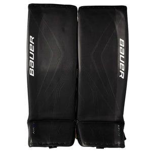 Black hockey goalie leg pads with Bauer branding on a white background