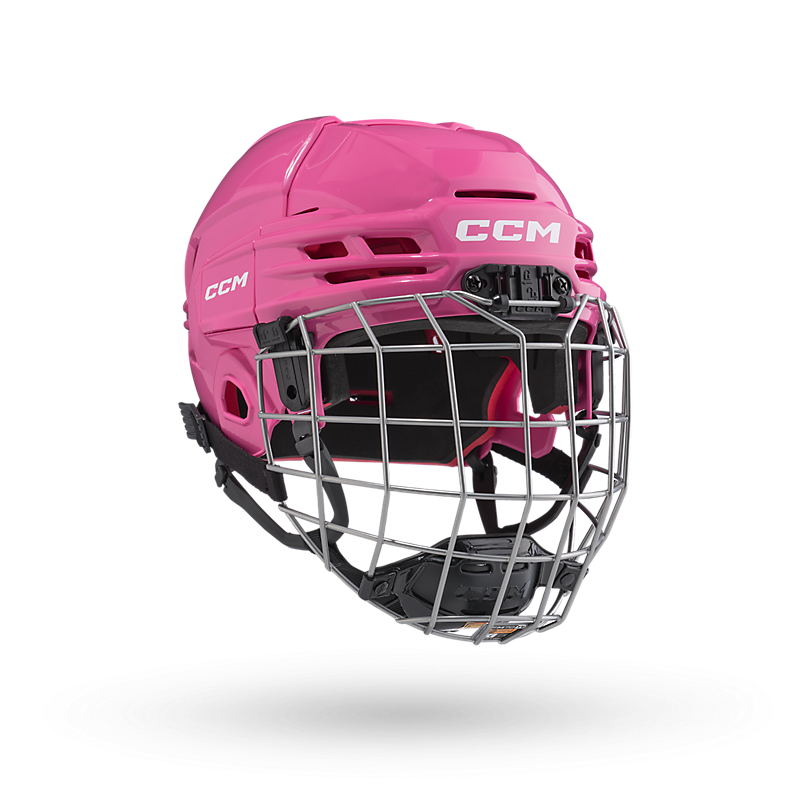 CCM Tacks 70 Helmet Combo for kids aged 7-10 with flip clip system, pink design, and vented shell.