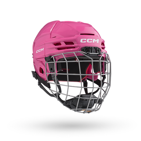 CCM Tacks 70 Helmet Combo for kids aged 7-10 with flip clip system, pink design, and vented shell.