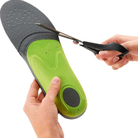 Person trimming SIDAS 3FEET SLIM INSOLE for low volume footwear.
