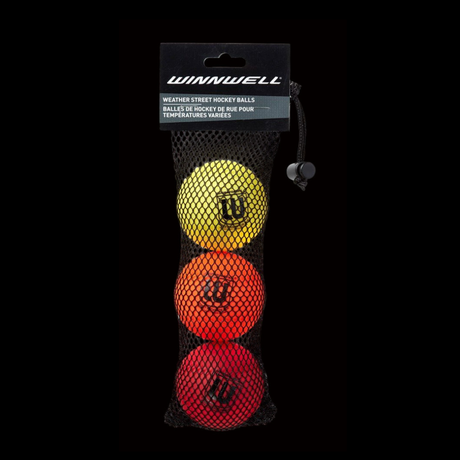 A three-pack of Winnwell multi.weather street hockey balls in red, yellow, and black colors, contained in a net bag.