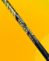 CCM Tacks AS6 Pro Hockey Stick against a yellow background.