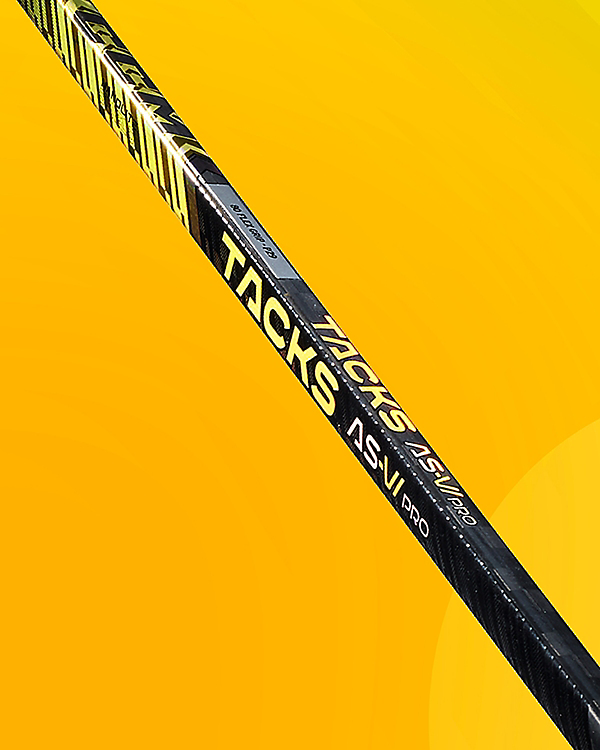 CCM Tacks AS6 Pro Hockey Stick against a yellow background.