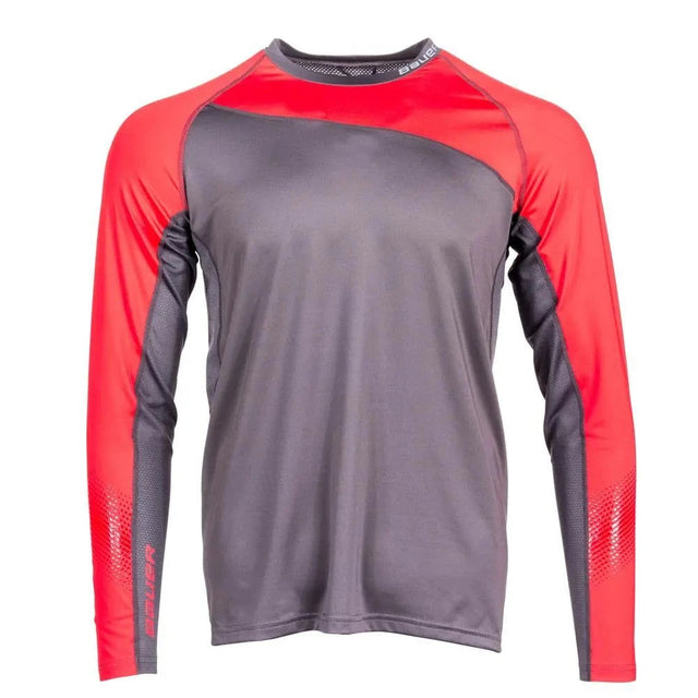 Bauer Pro Long Sleeve Base Layer Top with red sleeves and grey body, designed for odor prevention and mobility.