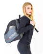 Edea Libra Skate Backpack with USB charging port and vented pockets on model.