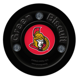 Black Green Biscuit NHL off-ice training hockey puck with Ottawa Senators logo.