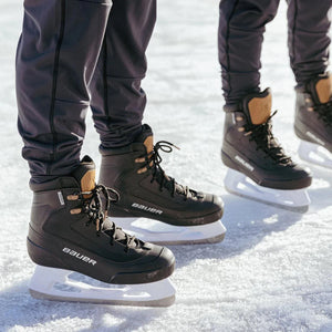 Bauer Colorado LifeStyle Skates on ice with sleek dark design and insulated liners.